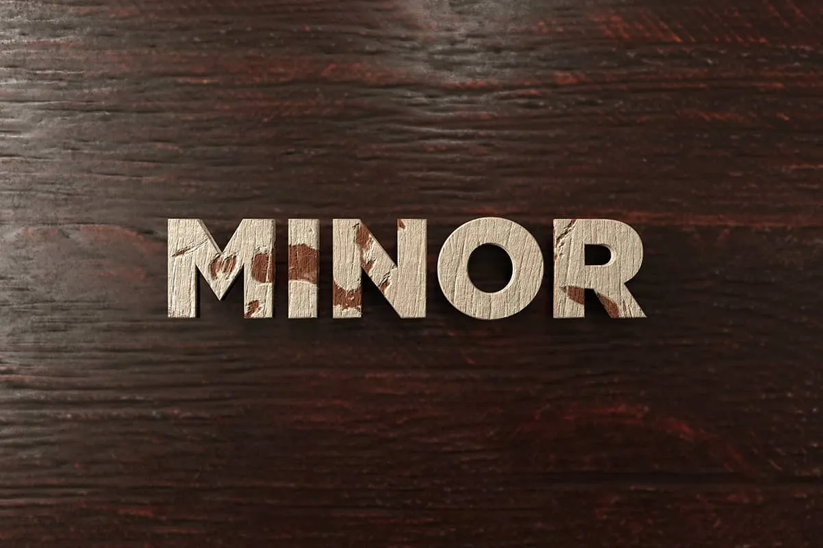 MINOR written on brown background 