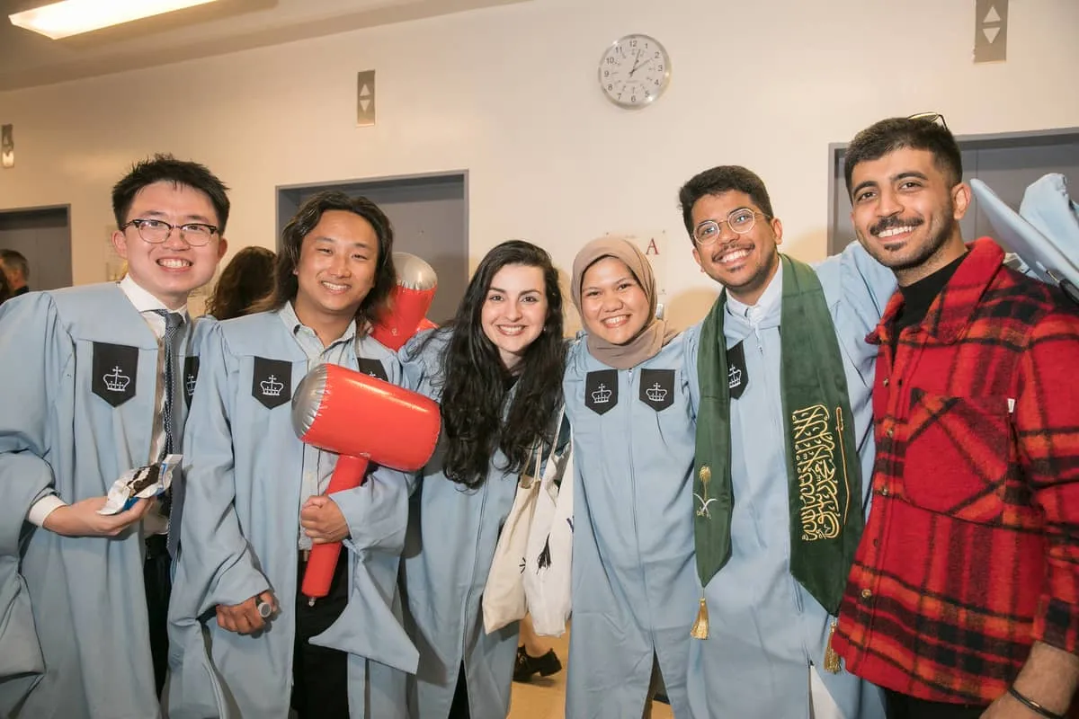 Group of Columbia University students in caps & gowns