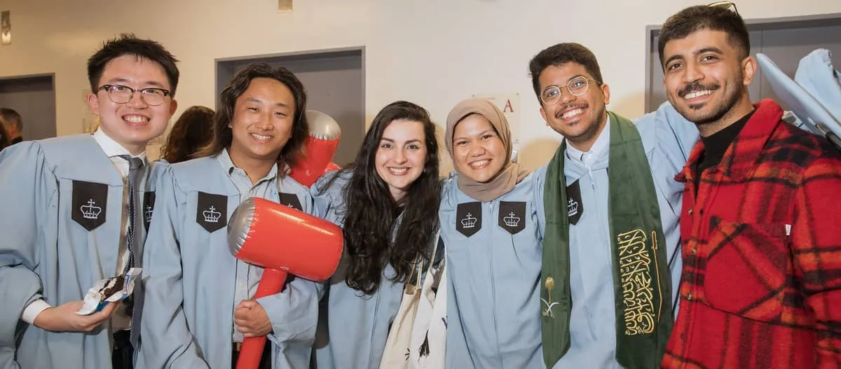 Group of Columbia University students in caps & gowns