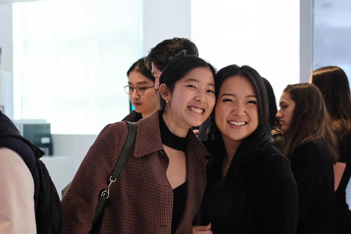 Photo of two females smiling 