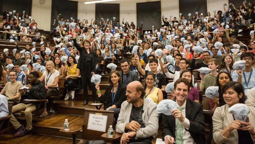 Dean Boyce and the Class of 2023 show off the traditional beanies handed out to Columbia Engineering first year students.